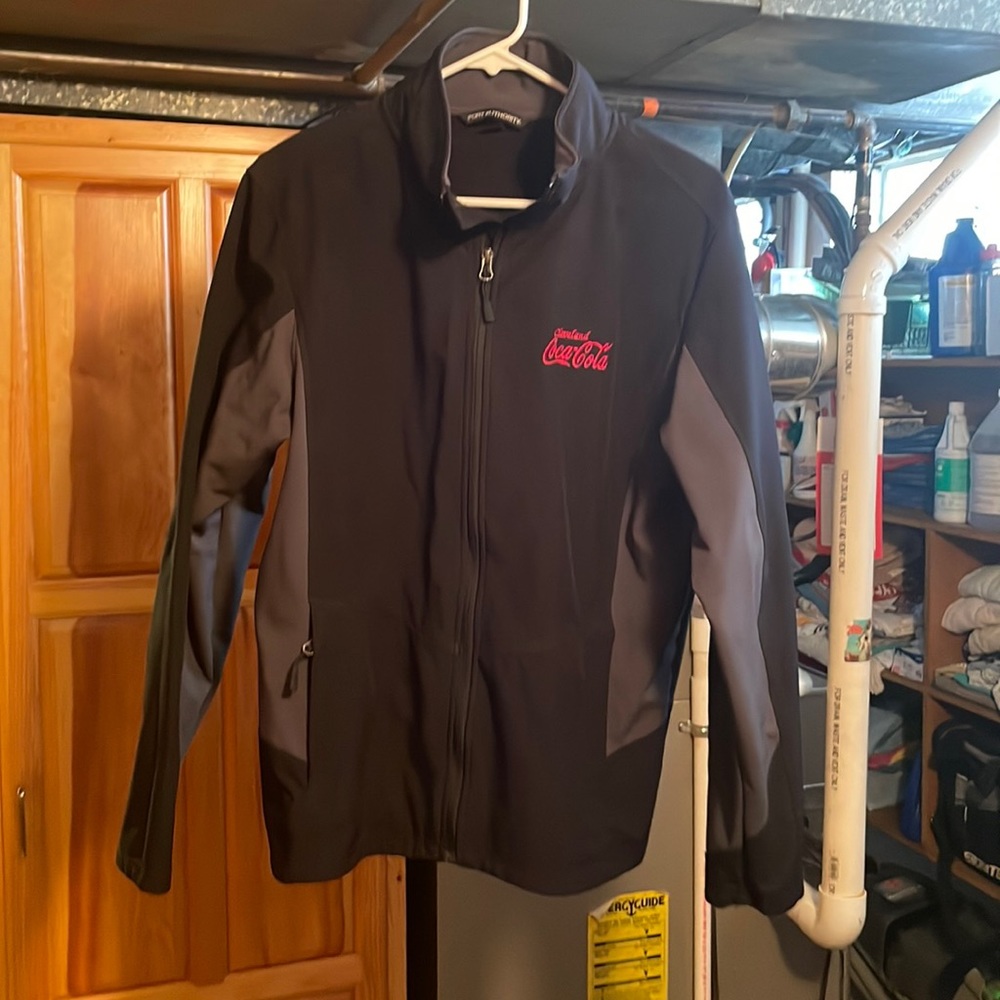 Cleveland Coca Cola light to medium weight coat Medium size like new